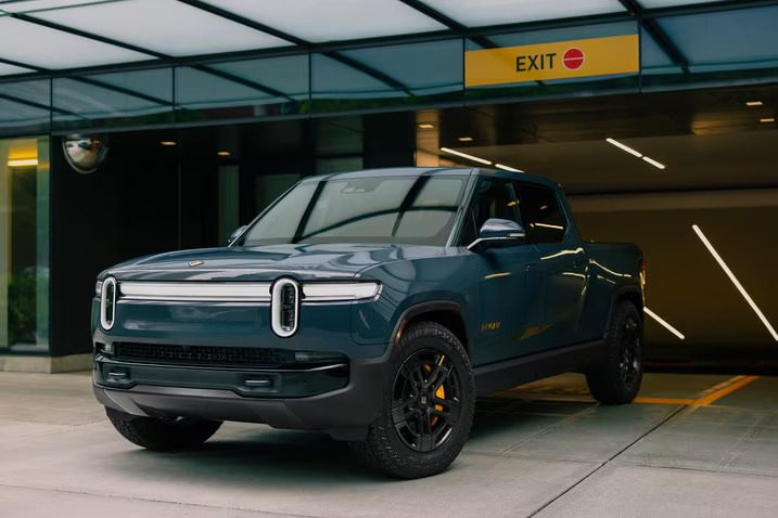 Rivian unveiled redesigned versions of its all-electric R1 pickup and SUV models, the R1T and R1S, featuring improved range.