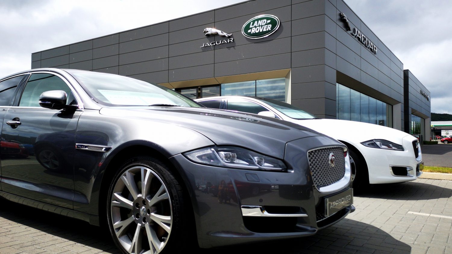 Jaguar Land Rover (JLR) reevaluates profit forecast as new U.S. tariffs raise uncertainty despite reporting strong financial results.