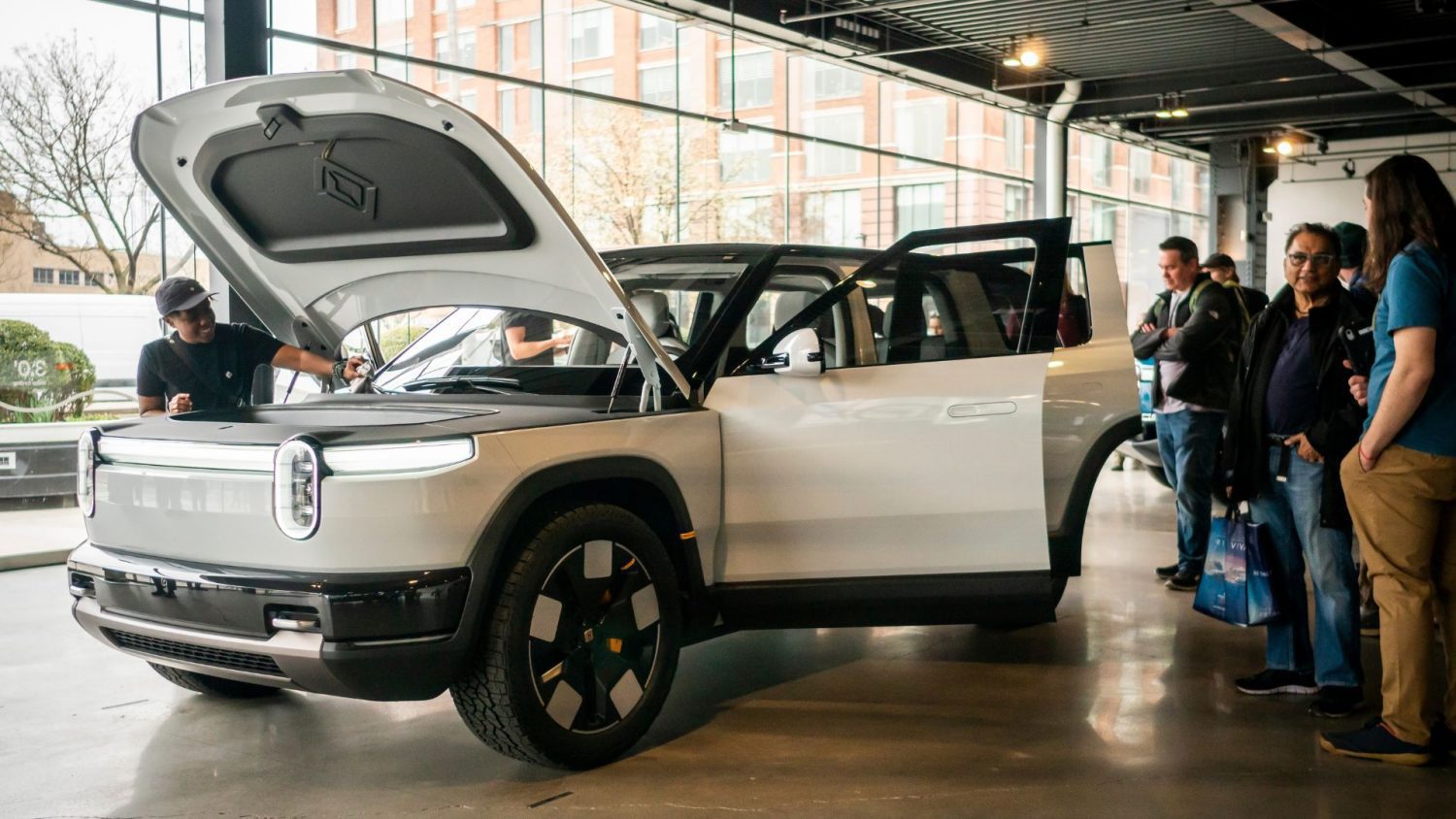 Rivian is laying off less than 1.5% of its workforce as the EV maker works to cut costs ahead of the launch of the R2 SUV, expected next year.