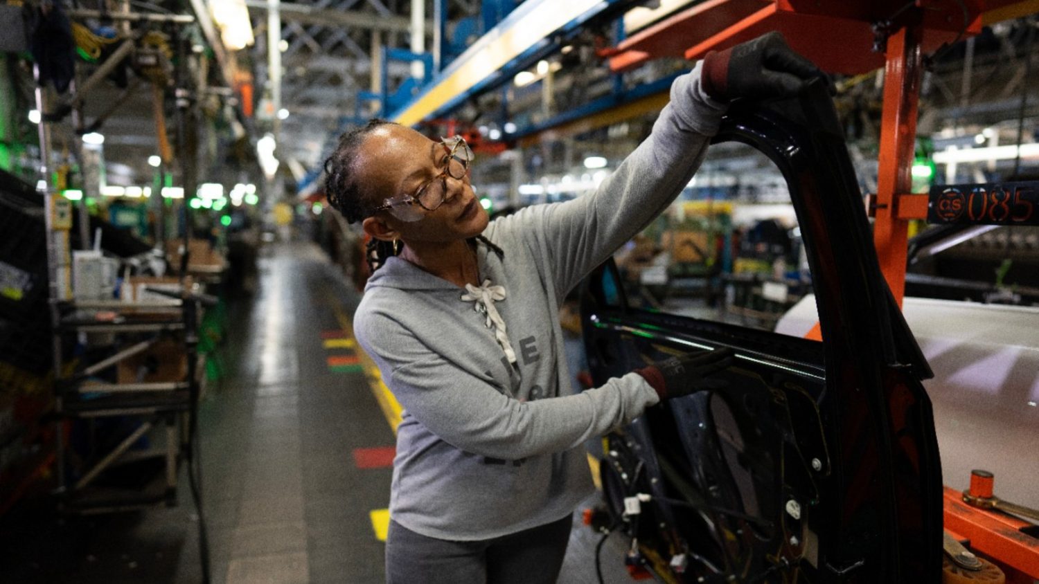 GM lays off 900 workers at Kansas plant after delaying second shift due to weaker EV demand and changes in federal incentives.